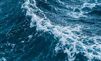 Deep blue ocean waves breaking